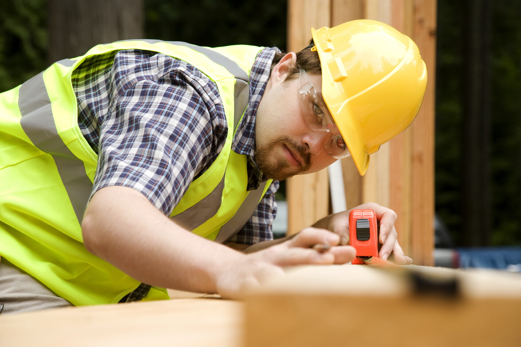 man wearing yellow hard hat working