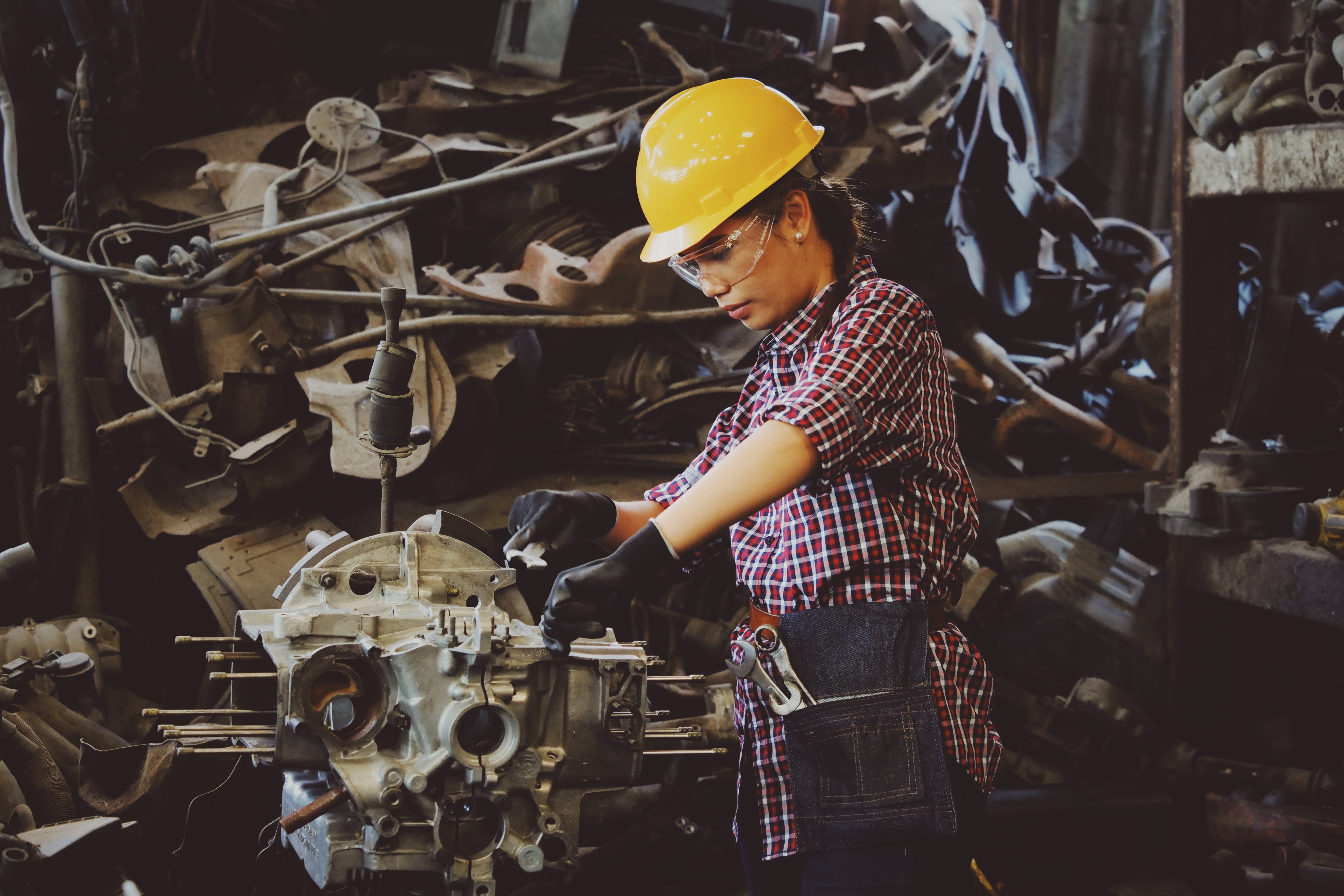 woman working with yellow hard hat