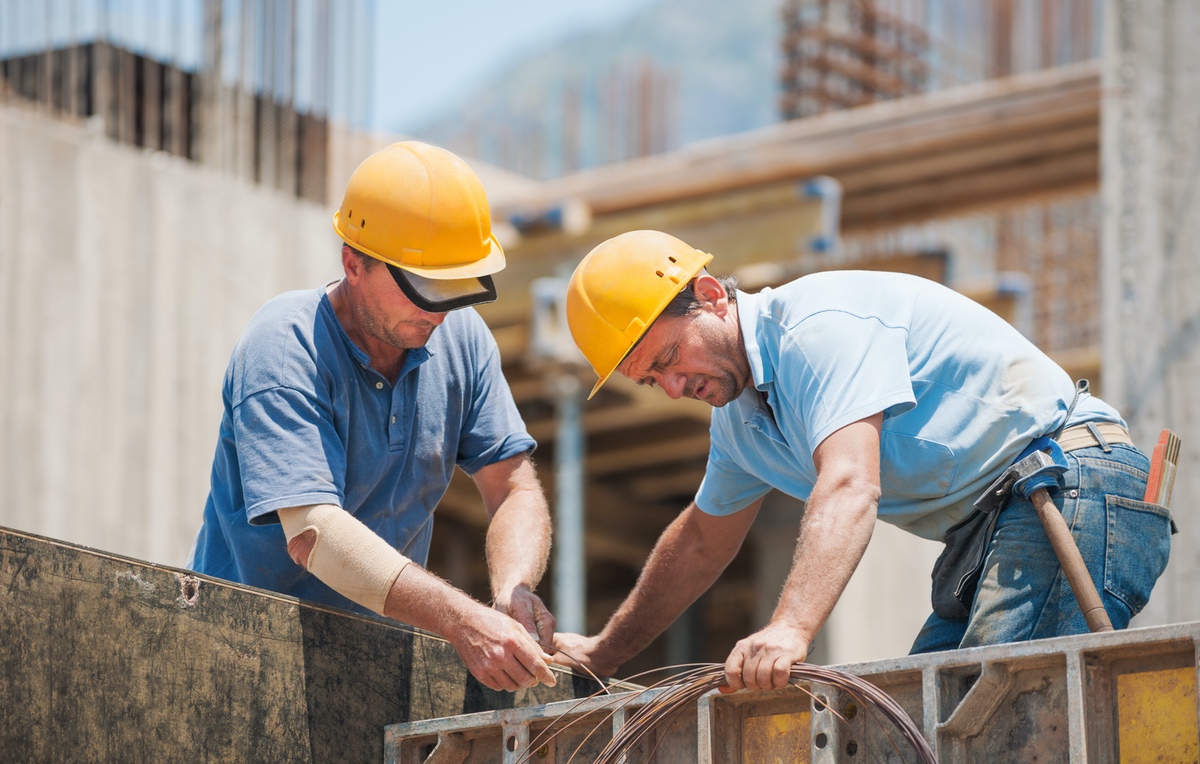 2 construction workers working